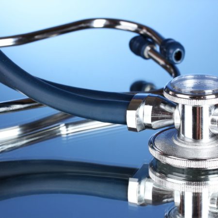 11220607 - medical stethoscope on blue background