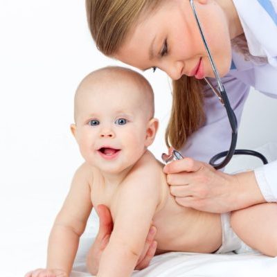 20151747 - kind and friendly doctor  pediatrician with stethoscope listening small baby heart